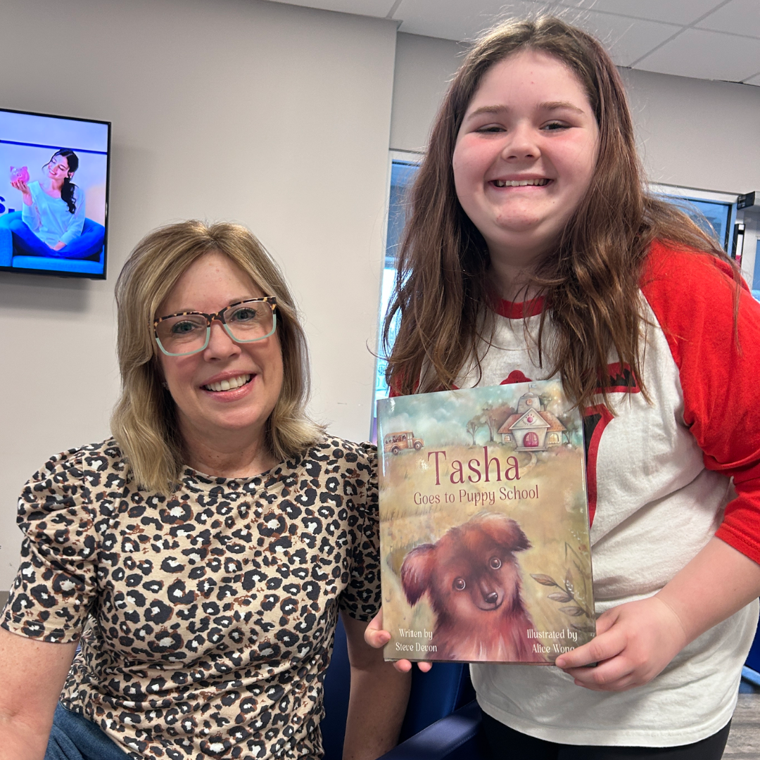 Tasha Goes To Puppy School Author reads book to child